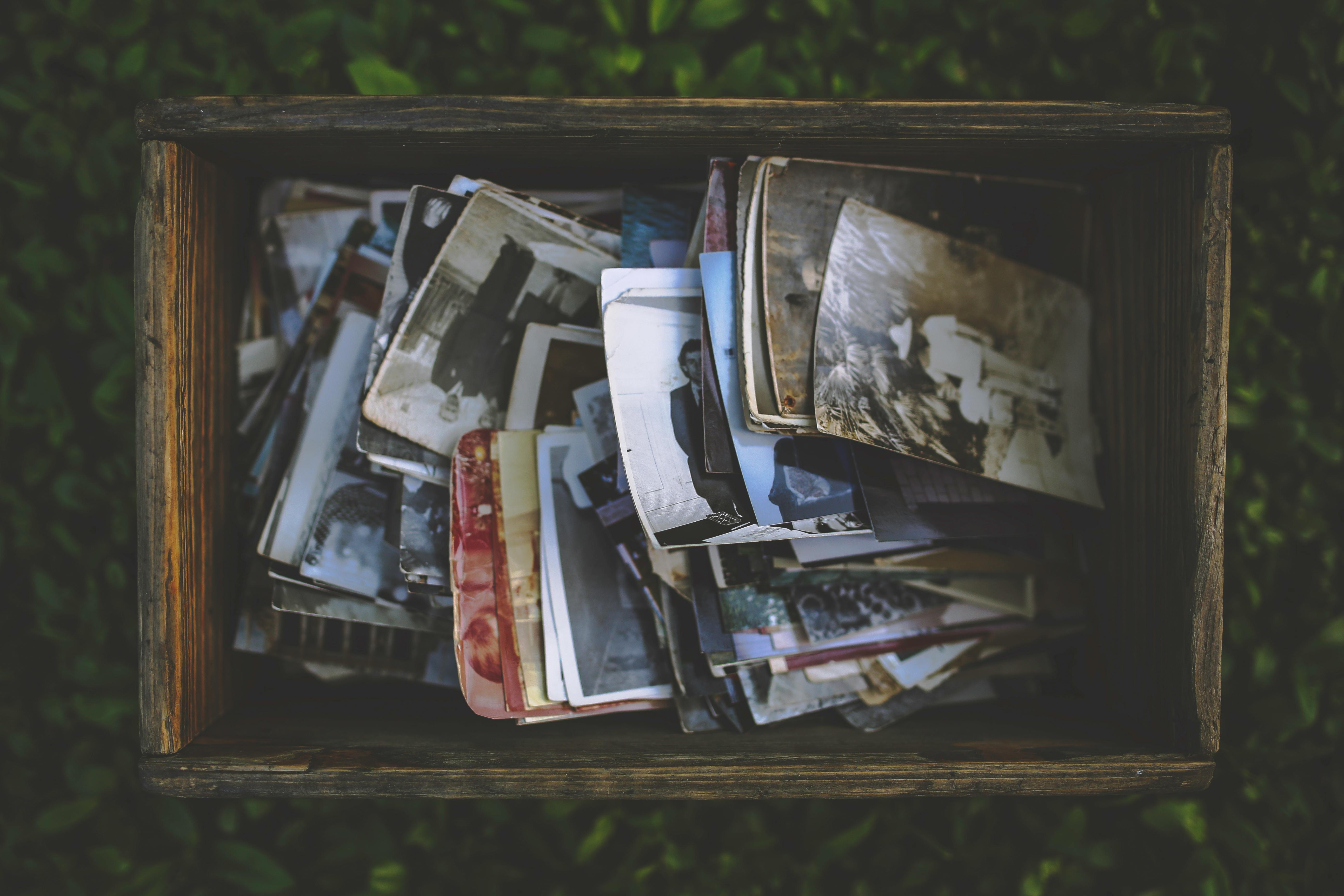 Box of old photos representing preserved memories