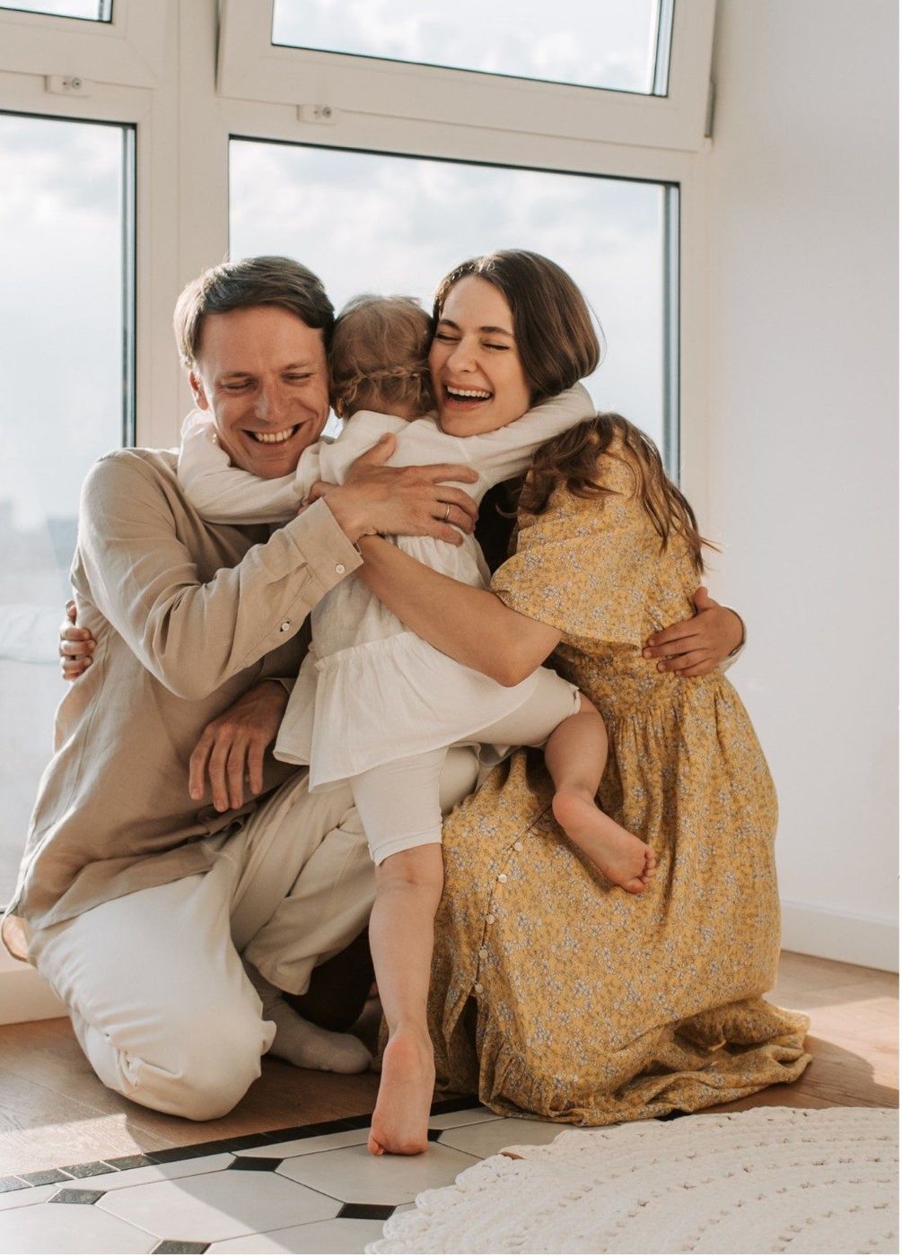 A family sharing a warm hug at home